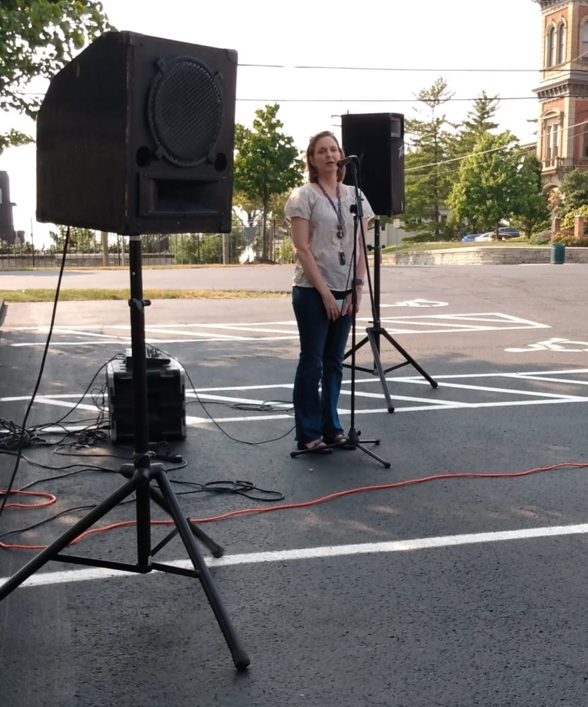 woman standing at microphone