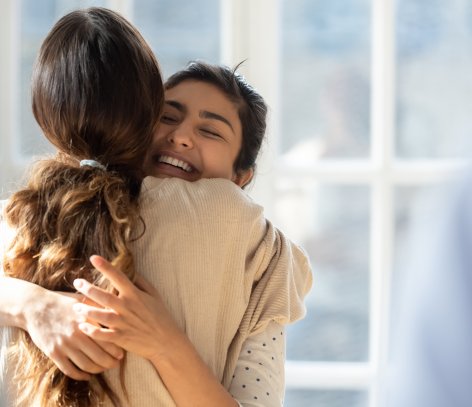 Two women hugging